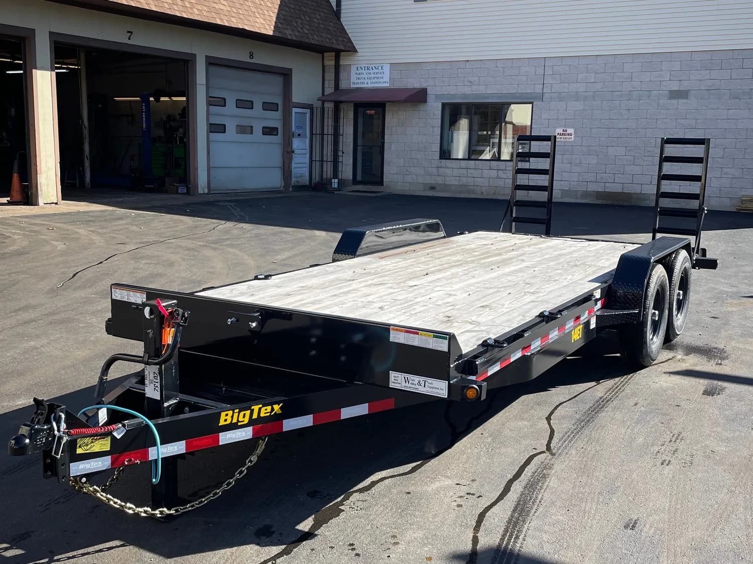 20 foot tandem-axle equipment trailer with fold-down ramps